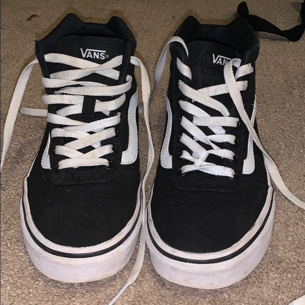 Black and white high top vans